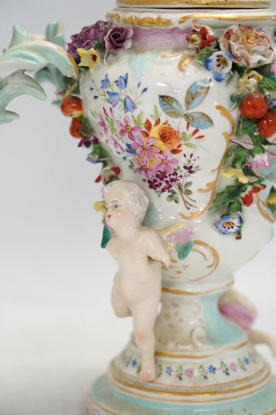 A pair of Potschappel porcelain floral encrusted vases and covers, 31cm high. Condition - poor